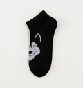 Black ankle sock with a wolf face design on a white background