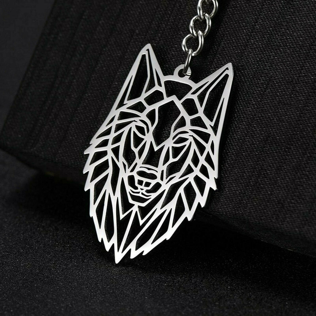 Geometric wolf head keychain on a black background