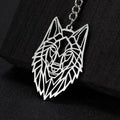 Geometric wolf head keychain on a black background